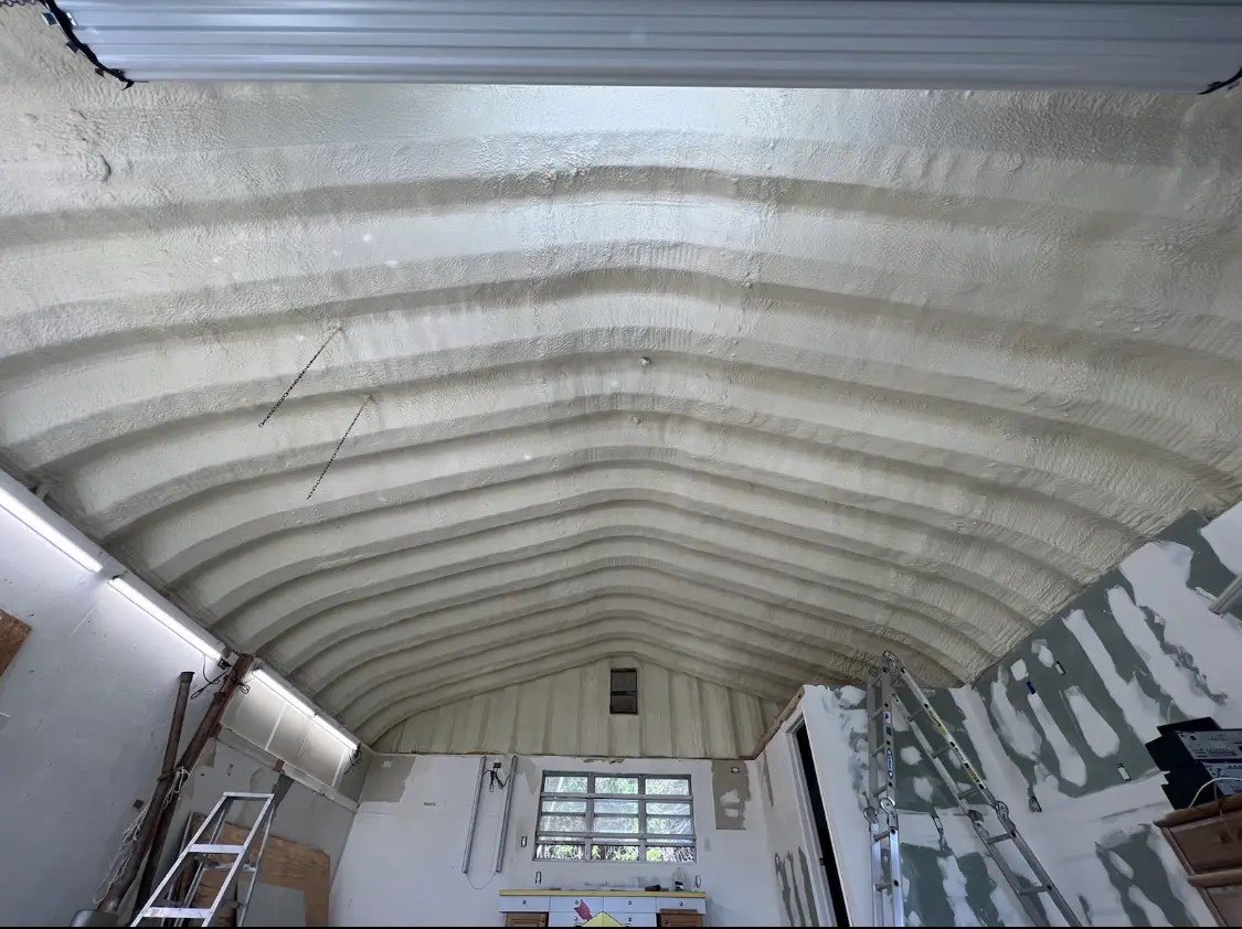 Spray polyurethane foam applied to the underside of a metal roof deck in Atoka